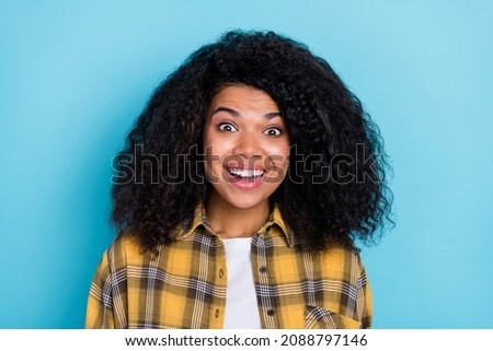 Photo of excited amazed funny lady omg reaction open mouth wear checkered shirt isolated blue color background