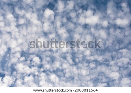 Beautiful blue sky with lots of small clouds