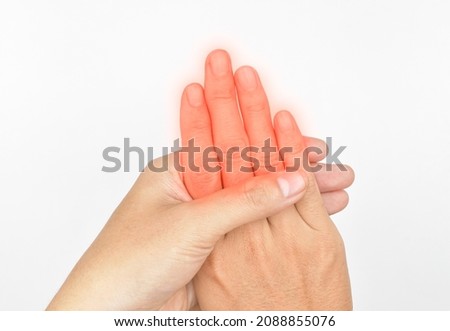 Inflammation of Asian young man’s fingers and hand. Concept of hand pain and finger problems.