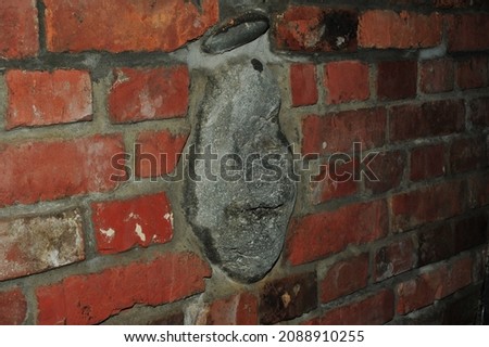 red old brick wall background, brick wall texture, structure. old broken brick, cement joints, close-up.