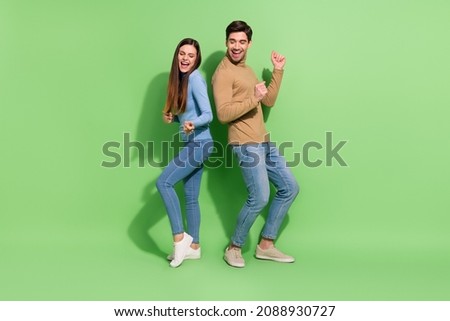 Photo of funny cheerful inspired couple enjoy clubbing discotheque wear casual outfit isolated green color background