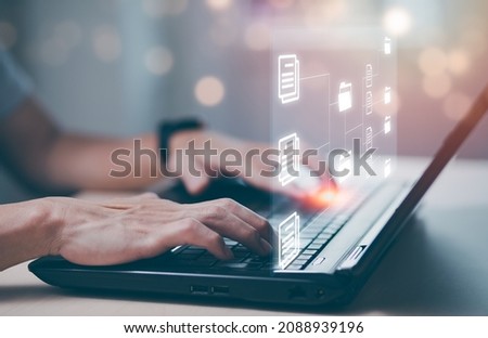 Online documentation database and document management system concept, Businessman using tablet or computer,Document Management System and Automation software to archiving and efficiently manage. Royalty-Free Stock Photo #2088939196