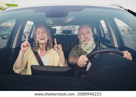 Photo of lovely senior married couple have fun listen music ride car vehicle together romantic trip outdoors Royalty-Free Stock Photo #2088946225