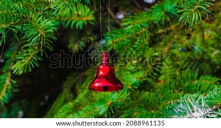 little christmas bells on fir branches copy space. High quality photo