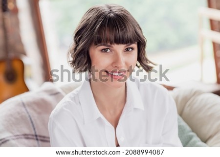 Photo of cute brunette hairdo young lady wear white shirt alone at home