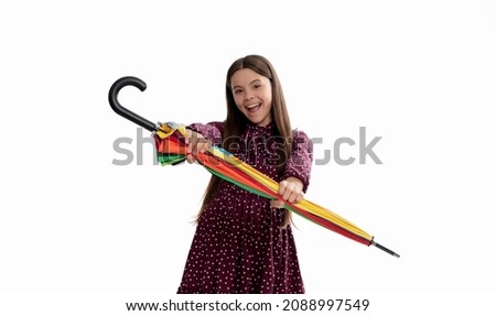 happy child hold colorful parasol. kid with rainbow umbrella isolated on white.
