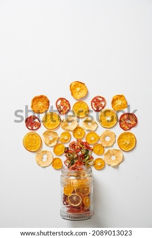 Assortment of Healthy and Tasty Dry Fruits on a White Background. Fruit Concept