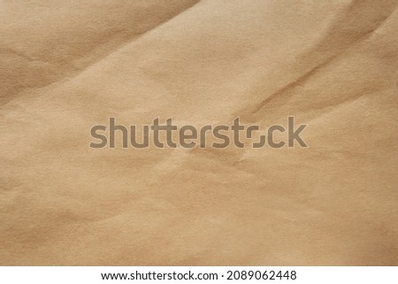 Creased Craft light brown color recyclable organic paper bag texture background Royalty-Free Stock Photo #2089062448