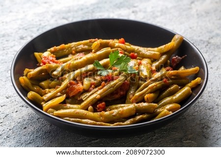 Traditional delicious Turkish food; Green beans with olive oil; Turkish name; Zeytinyagli taze fasulye Royalty-Free Stock Photo #2089072300