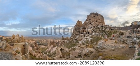 Uchisar Castle, town in Cappadocia, Turkey near Goreme. Panorama of Cappadocia landscape and valley with ancient rock formation and caves. Royalty-Free Stock Photo #2089120390