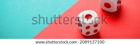 Dice on a green-red backdrop banner panoramic with copy space