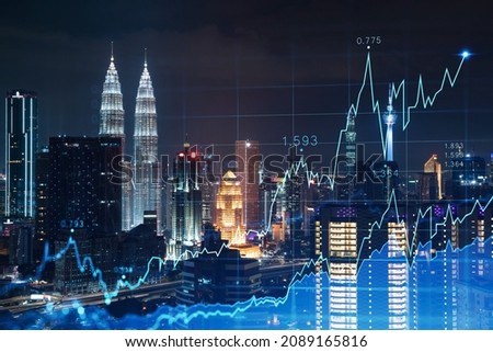 Stock market graph hologram, night panorama city view of Kuala Lumpur. KL is popular location to gain financial education in Malaysia, Asia. The concept of international research. Double exposure. Royalty-Free Stock Photo #2089165816