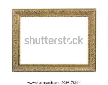 Old empty wooden frame for paintings with gold patina. Isolated on white background