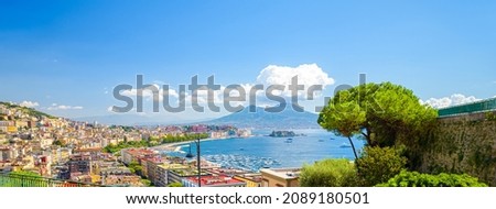 Naples, Italy. View of the Gulf of Naples from the Posillipo hill with Mount Vesuvius far in the background and a pine tree on the right. Banner horizontal. Royalty-Free Stock Photo #2089180501