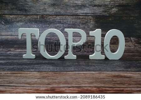 Top 10 word alphabet letters on wooden background