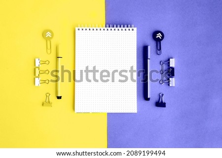 School supplies. Yellow and violet colors. Flat lay composition. Back to school. Demonstrating the colors of 2022 - Very Peri. Changing colors of the year concept. Illuminating and very pari.