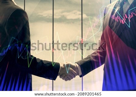 Double exposure of forex graph hologram and handshake of two men. Stock market concept.