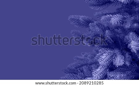 Very peri colored Christmas fir tree on banner with copy space. Xmas monochrome minimalist background.