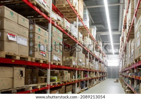 warehouse in the logistics center with boxes ready for shipment, blurred photography, defocus