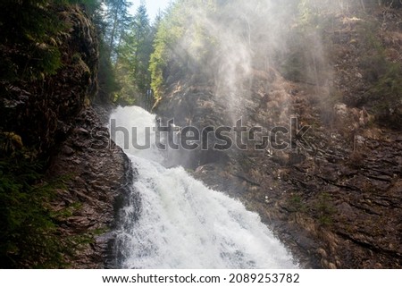 Waterfall and mist on a spring day
