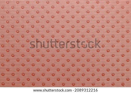 The background is made of anti-slip fabric with spot application in a checkerboard pattern of a delicate powdery pink color.For the manufacture of mops, car covers, sock soles, medical products Royalty-Free Stock Photo #2089312216