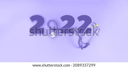 Background Very peri with stethoscope and numbers 2022. happy new year 2022 with Very Peri is trends color . Number 2022 with Stethoscope isolated background. health medical concept