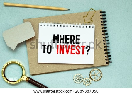 Hand writing the text: Where to Invest