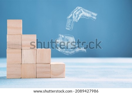 icon of a hand putting money in a piggy bank and next to a ladder of cubes