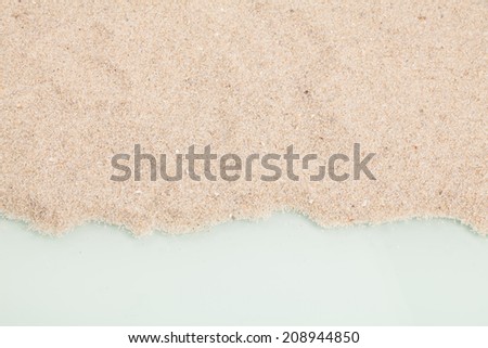 closeup of a pile of sand of a beach or a desert on a white background