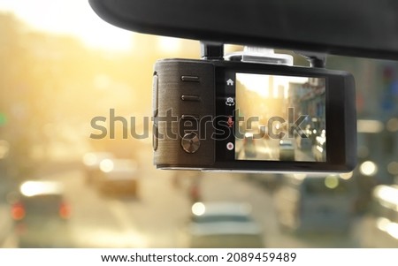 Digital video recorder car camera for safety on the road accident, Technology recorder device capturing video of front of vehicle automobile crash safety proof evidence. Royalty-Free Stock Photo #2089459489