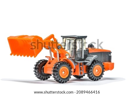 Bucket loader Toy  Car on White Background, orange  model car isolated 