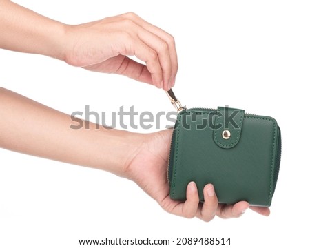 Hand holding green wallet isolated on white background. Royalty-Free Stock Photo #2089488514