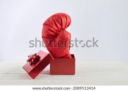 Boxing day shopping creative idea. Boxing glove coming out of gift box. Royalty-Free Stock Photo #2089513414