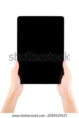 Hands holding black tablet, isolated on white background. Digital tablet in hands. Hands holding tablet touch computer gadget with isolated screen.