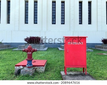 Water hydrant in a garden in front of a building
