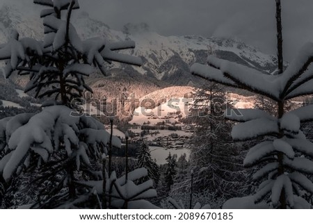 Amazing sunset scenery in the austrian alps at a winter day.