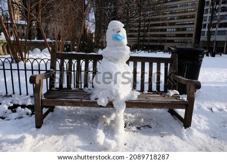 Statue making from snow, snowman, selective focus. That is snow not grain. Happy Snowman on snow, funny winter time in Rittenhouse Square Park, Philadelphia, USA. It is called "Kardan Adam" in Turkish