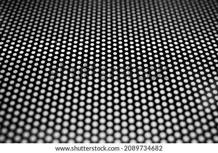 Perforated carbon surface texture background