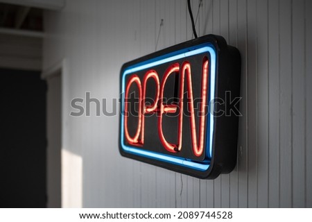 Vintage Neon Open Sign Hanging on White Wall