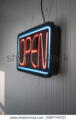 Vintage Neon Open Sign Hanging on White Wall