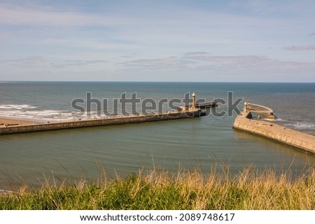 View of the sea and pier at Whitby, North Yorkshire, England 