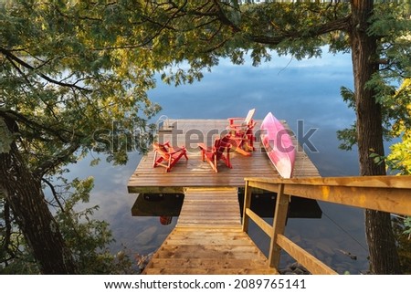 Stairs descend to a lakeside dock Royalty-Free Stock Photo #2089765141