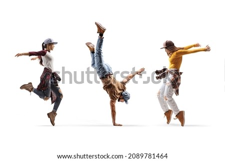 Two female dancers and one male dancer performing a hand stand isolated on white background Royalty-Free Stock Photo #2089781464