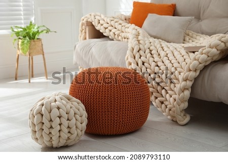 Stylish comfortable poufs in room. Home design Royalty-Free Stock Photo #2089793110