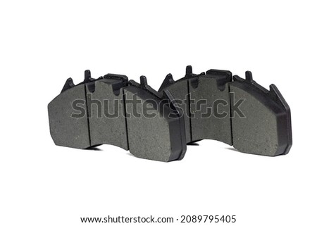 A pair of new brake pads on isolated white background