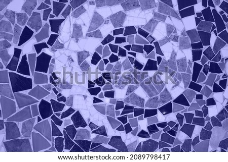 ceramic mosaic floor or wall. photo toned in the color of the year very peri. mosaic top view. Bathroom or kitchen floor wall design idea. Reused broken tile. Interior design