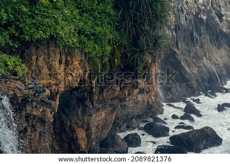 Natural background, waves break on rocks