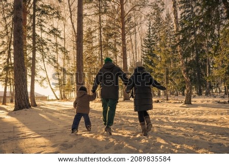 family running in winter time