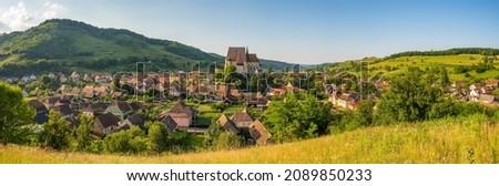 Panorama of Biertan village in Transylvania with historic Biertan fortified saxon church, Unesco World Heritage site, Romania, Europe. Romania travel destination Royalty-Free Stock Photo #2089850233