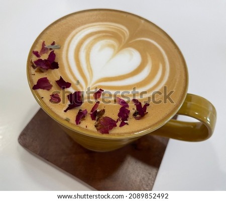 Close up of a cup of cappuccino with dry rose leafs topping, Hong Kong